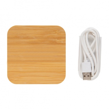 Лого трейд бизнес-подарки фото: Беспроводное зарядное устройство Bamboo 5 Вт с USB-портом